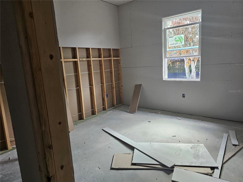 292 Gardenia Road Kissimmee, FL 34743 - Photo 11 of 23 a view of an empty room with a window