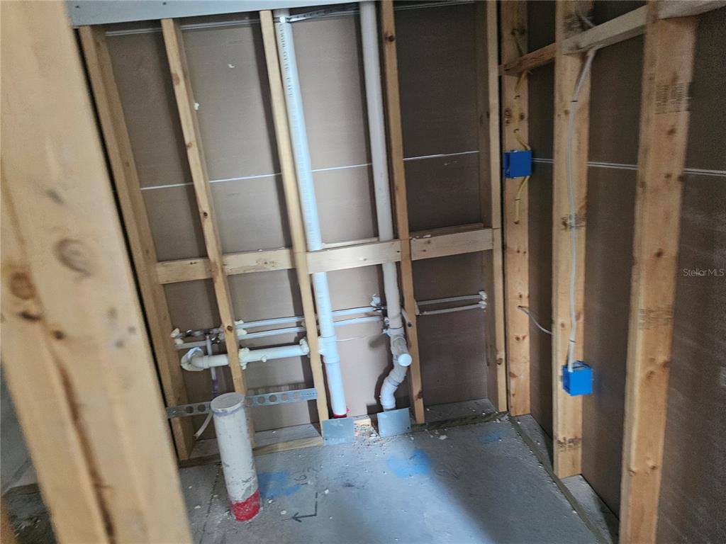 292 Gardenia Road Kissimmee, FL 34743 - Photo 12 of 23 a view of walk in closet with empty racks