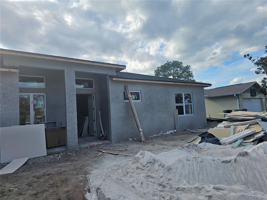 292 Gardenia Road Kissimmee, FL 34743 - Photo 23 of 23 a view of a house with backyard and seating area