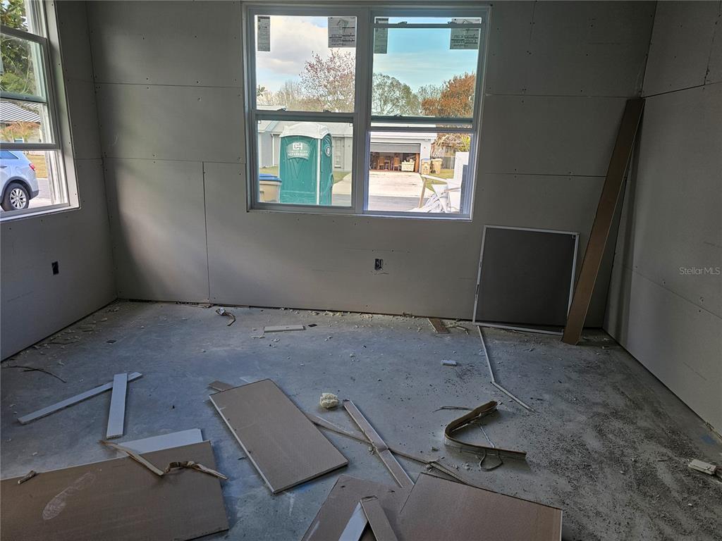 292 Gardenia Road Kissimmee, FL 34743 - Photo 3 of 23 a room with furniture and window