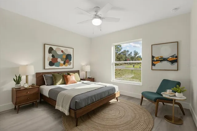 a bedroom with a bed and a window