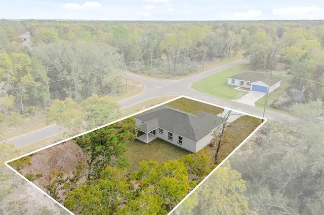 a view of a swimming pool with a yard