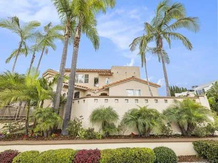 a front view of a multi story building with yard