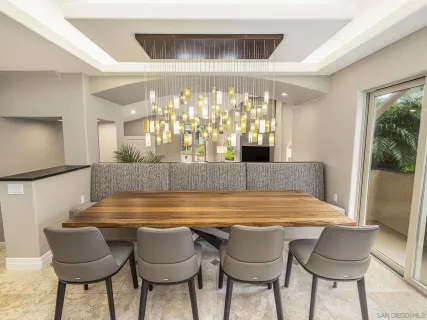 a large kitchen with a table and chairs