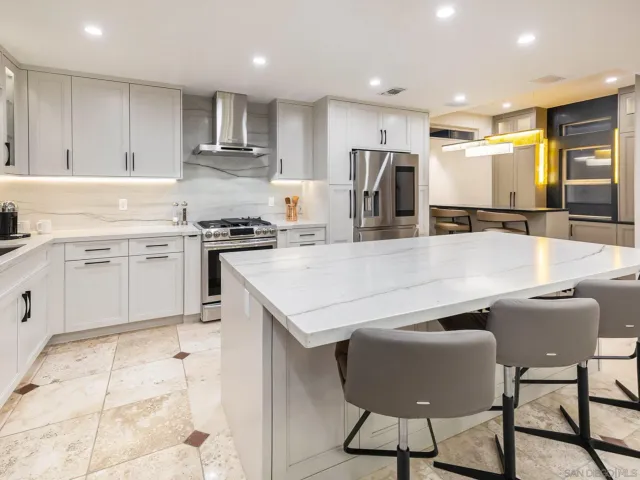 a kitchen with a table and chairs