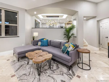 a dining room with furniture and window