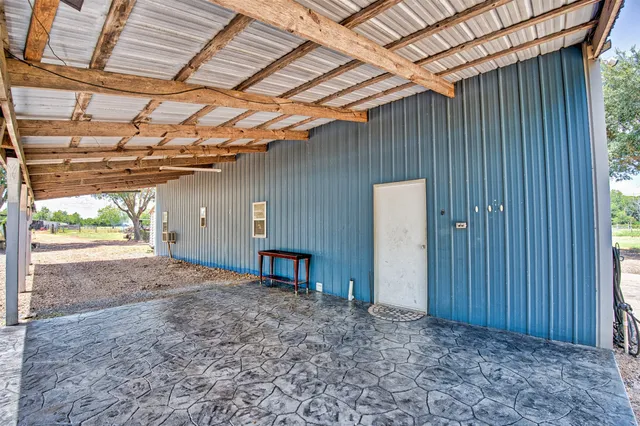 a view of a yard with large trees