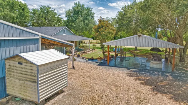 a view of a outdoor space with a patio and furniture