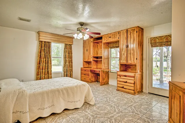 a spacious bathroom with a double vanity sink a mirror and a bathtub