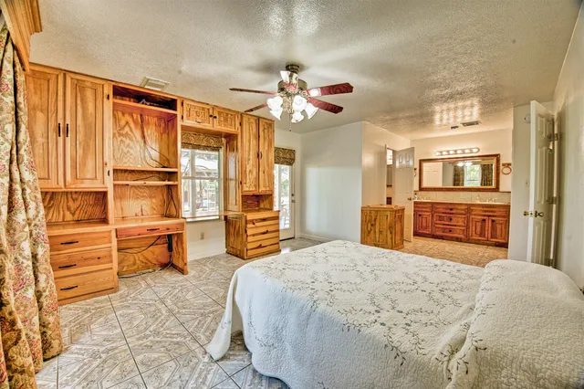 a bathroom with a toilet sink and shower