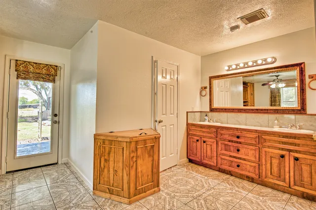 a view of a park with large trees