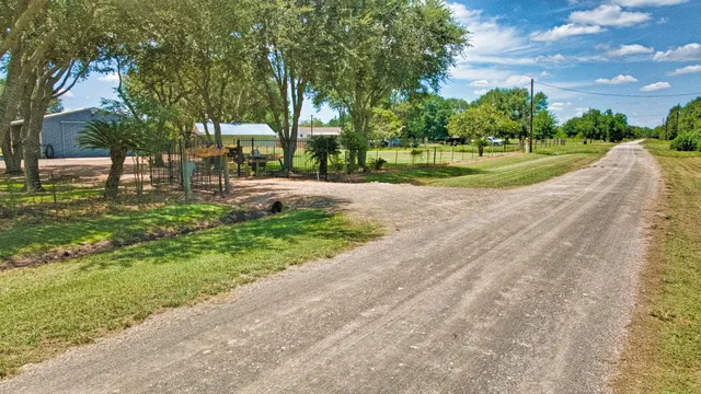 a front view of a house with swimming pool having outdoor seating