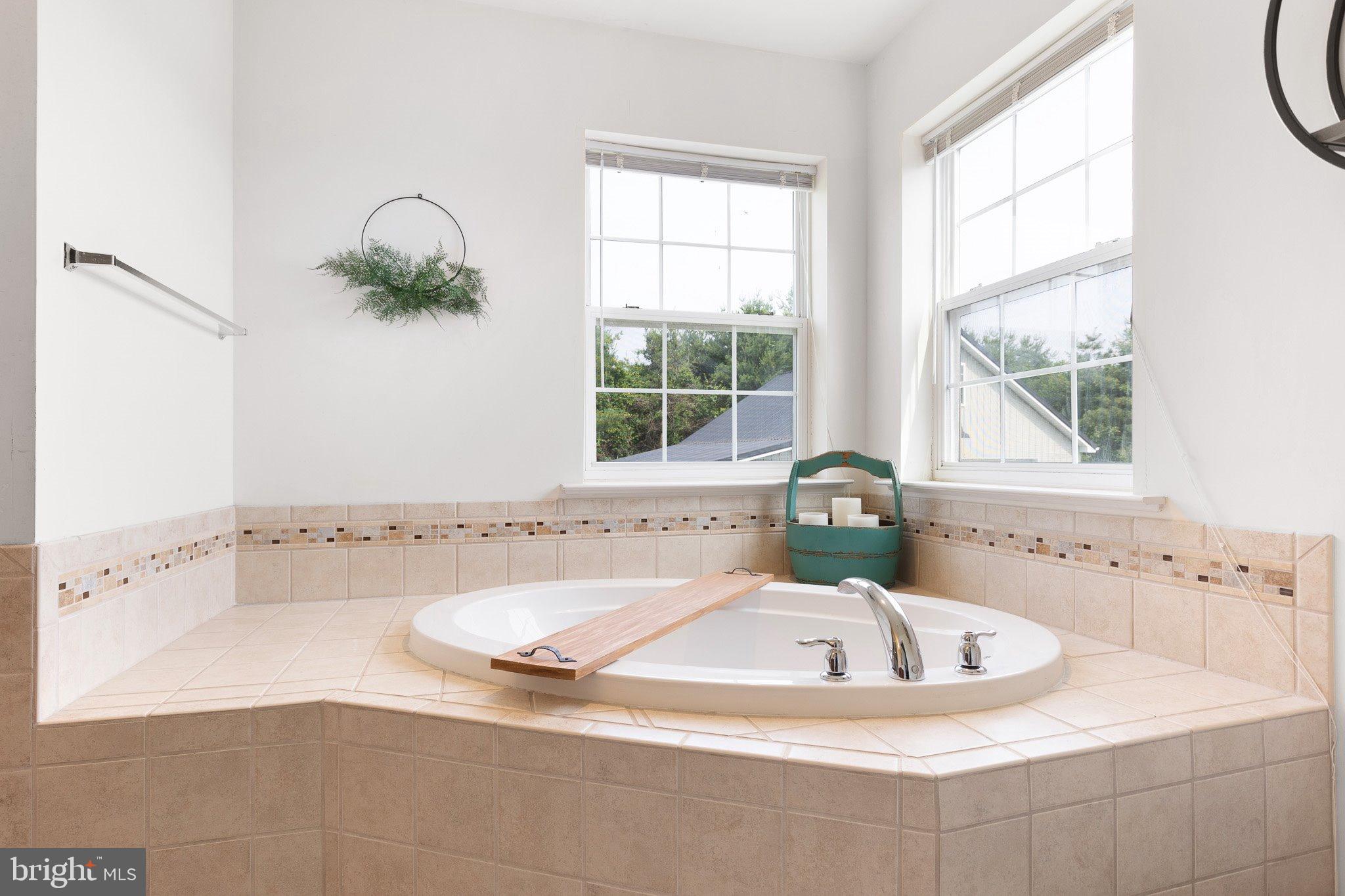 78 Lee Way Elkton, MD 21921 - Photo 23 of 39 a bath tub sitting in a bathroom next to a window