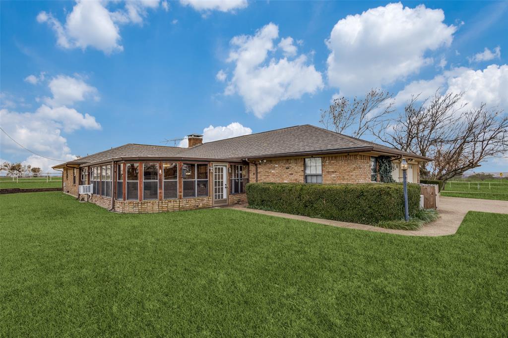 20967 Farm To Market 121 Gunter, TX 75058 - Photo 16 of 16 a view of a house with a yard