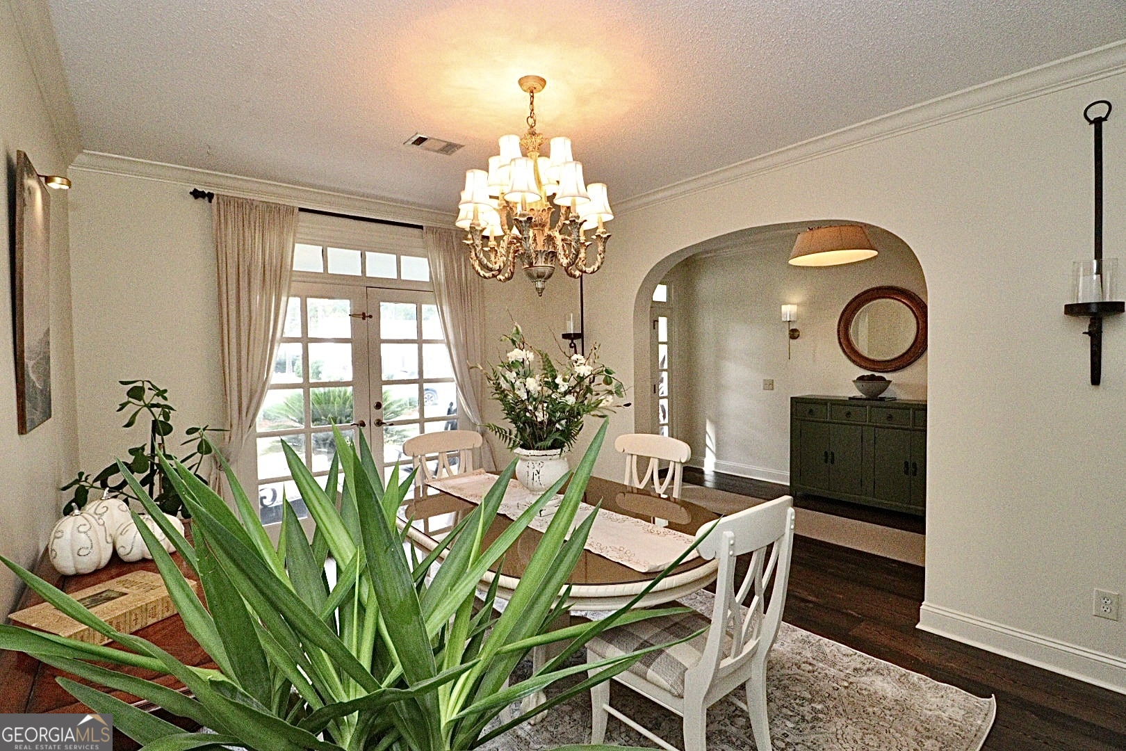 1410 Forest Way Nashville, GA 31639 - Photo 14 of 76 a view of a dining room with furniture and chandelier