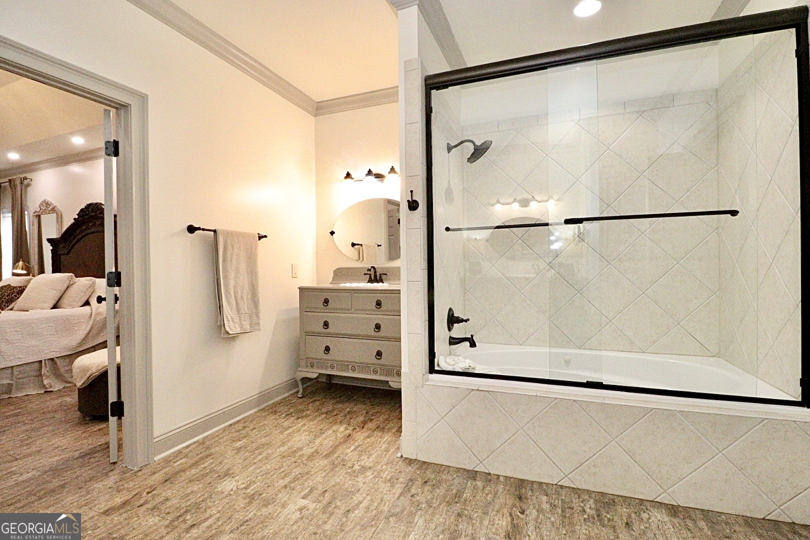 1410 Forest Way Nashville, GA 31639 - Photo 37 of 76 a view of walk in closet and bedroom