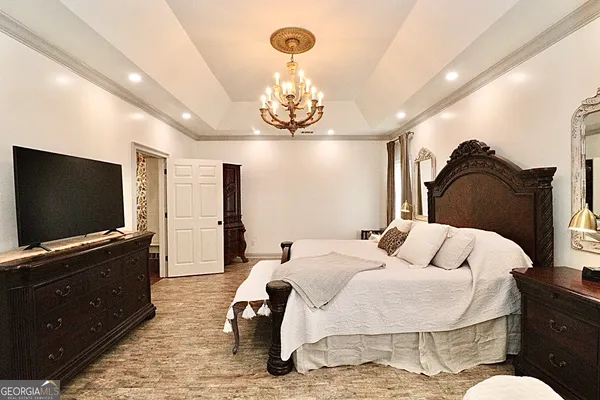 a view of a livingroom with furniture and a ceiling fan