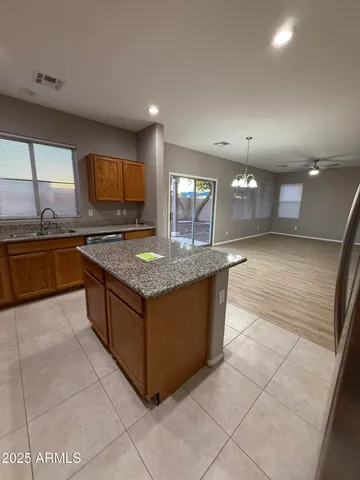 a kitchen with stainless steel appliances granite countertop a stove and a sink