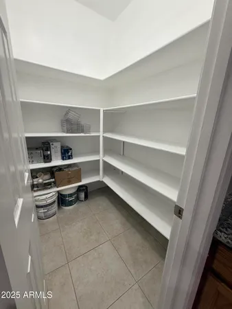 a room with walk in closet and a window