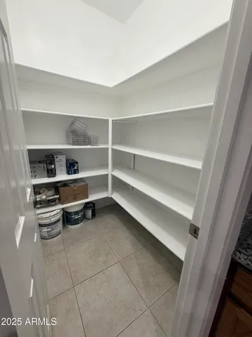 a room with walk in closet and a window