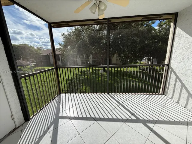 a view of a balcony with wooden floor