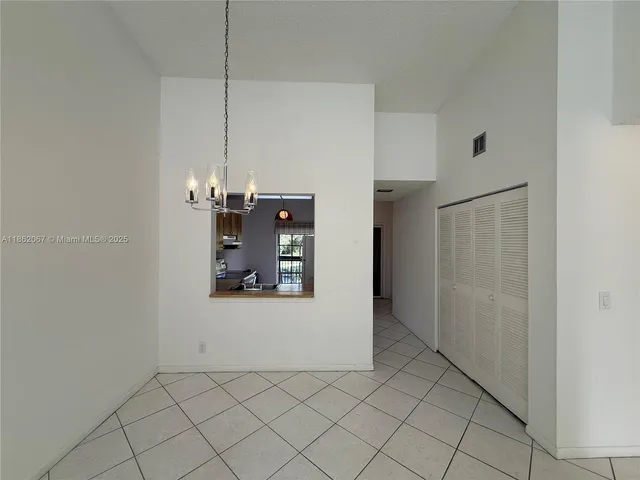 a view of a storage & utility room with cabinet