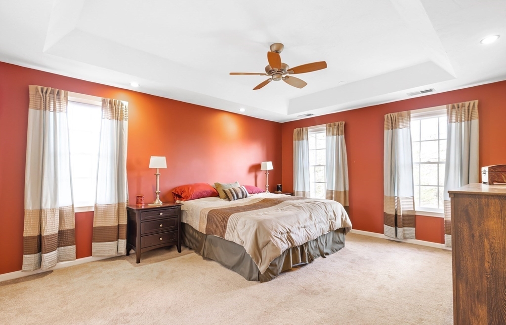 162 Ewald Avenue Marlborough, MA 01752 - Photo 14 of 30 a bedroom with a bed and large windows