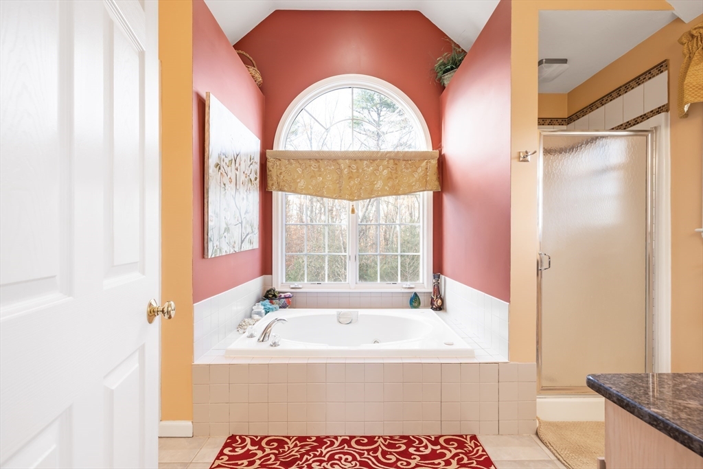 162 Ewald Avenue Marlborough, MA 01752 - Photo 15 of 30 a bath tub sitting next to a window