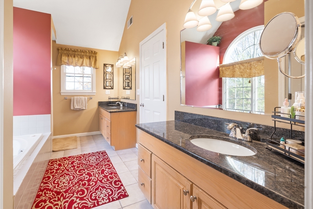 162 Ewald Avenue Marlborough, MA 01752 - Photo 16 of 30 a bathroom with a granite countertop sink and a mirror