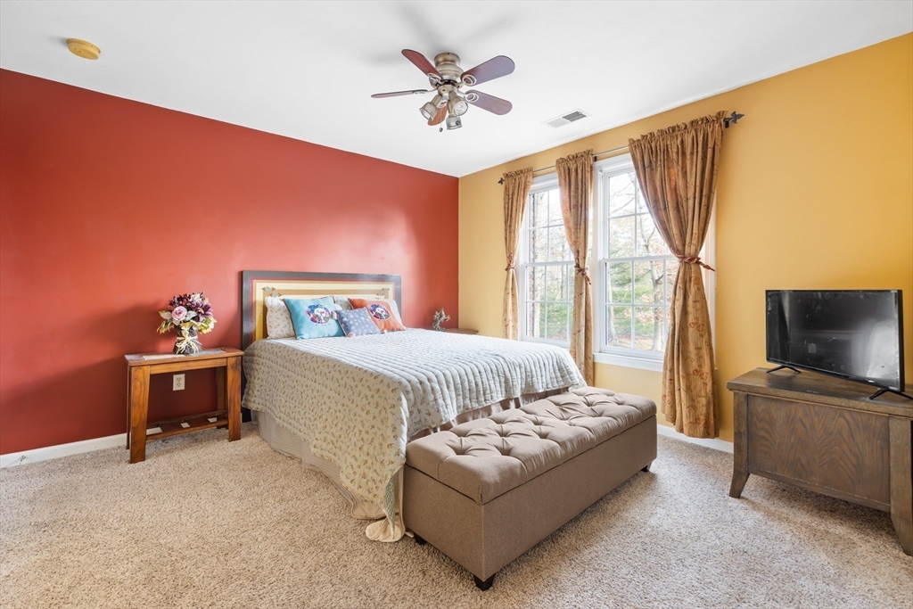 162 Ewald Avenue Marlborough, MA 01752 - Photo 18 of 30 a bedroom with a bed and a flat screen tv