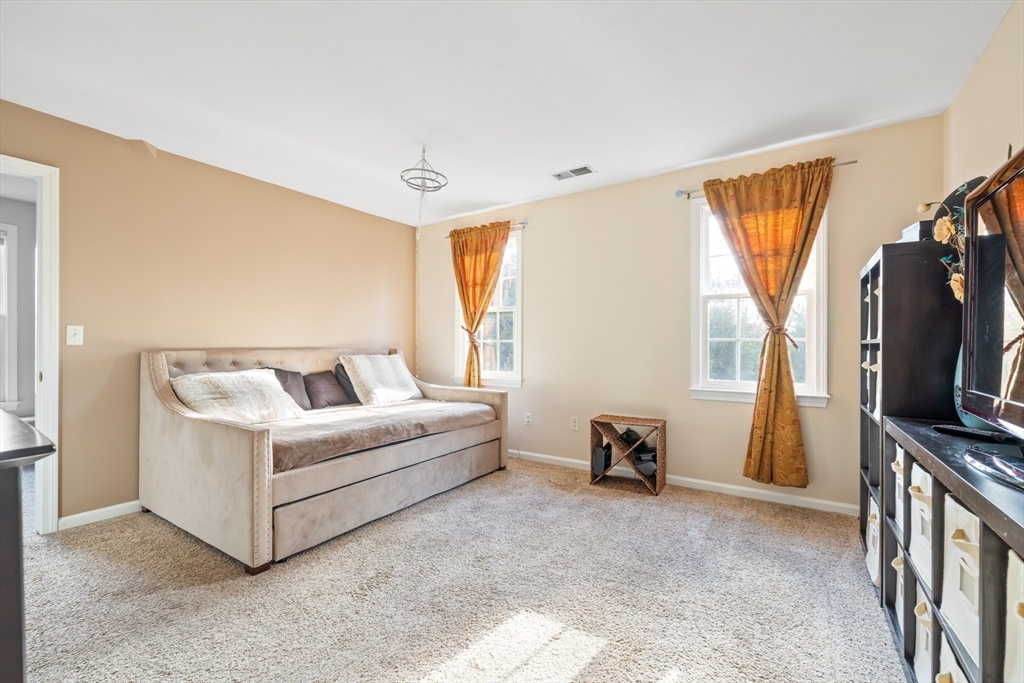 162 Ewald Avenue Marlborough, MA 01752 - Photo 20 of 30 a living room with furniture and a flat screen tv