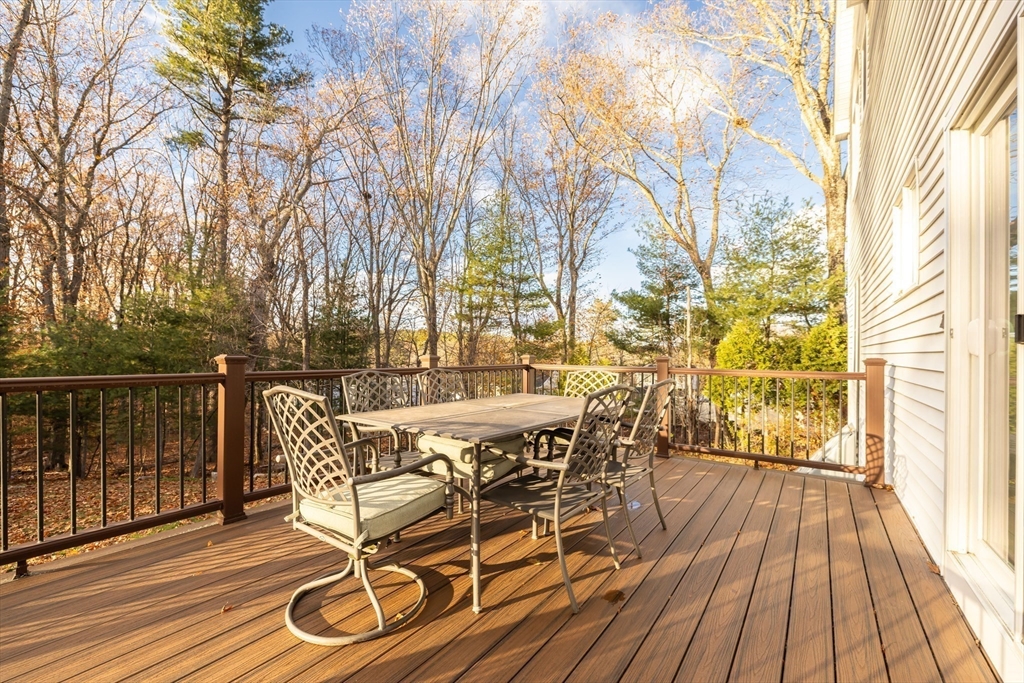 162 Ewald Avenue Marlborough, MA 01752 - Photo 24 of 30 a view of a patio with table and chairs and wooden floor
