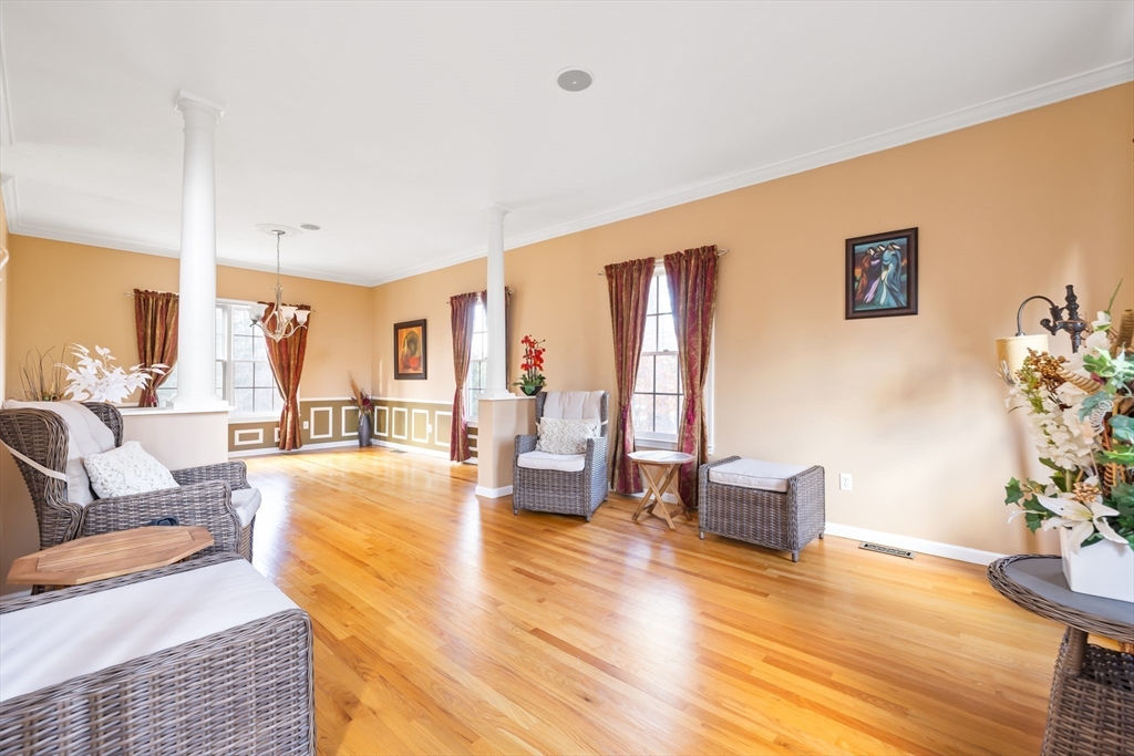 162 Ewald Avenue Marlborough, MA 01752 - Photo 5 of 30 a living room with fireplace furniture and a wooden floor