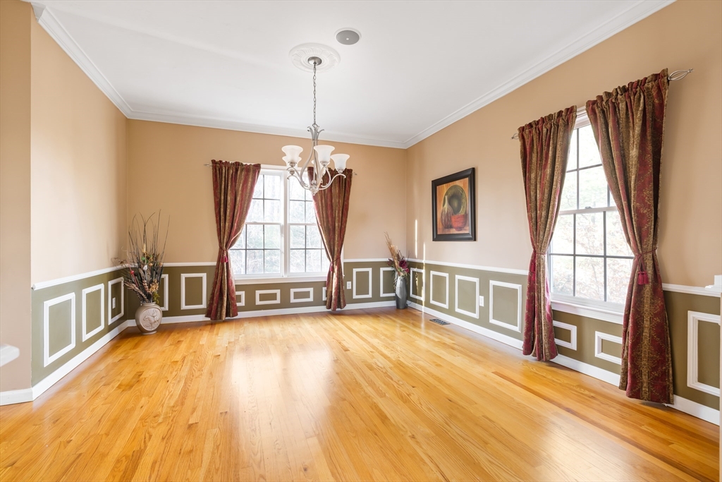 162 Ewald Avenue Marlborough, MA 01752 - Photo 6 of 30 a view of an empty room with wooden floor and a window