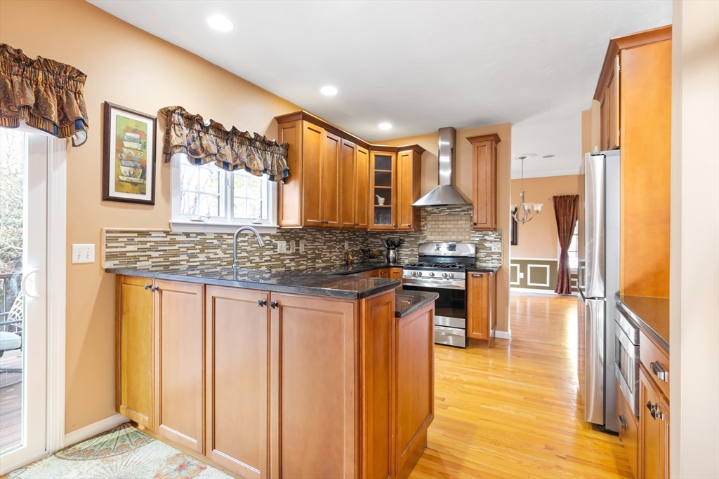 162 Ewald Avenue Marlborough, MA 01752 - Photo 7 of 30 a kitchen with stainless steel appliances granite countertop a stove a sink and a refrigerator