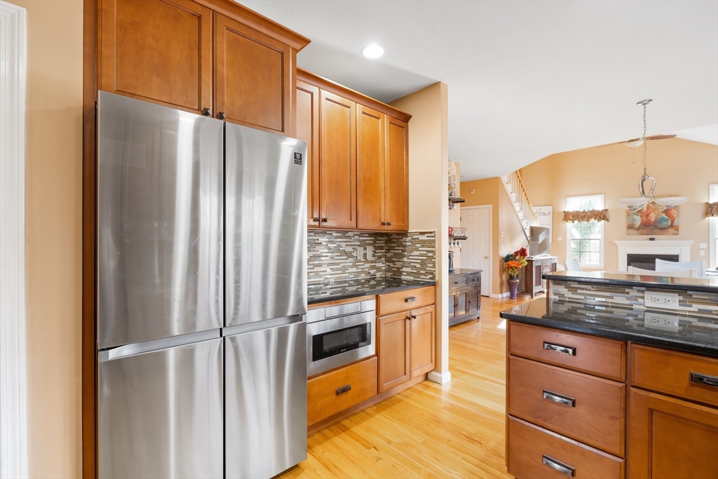 162 Ewald Avenue Marlborough, MA 01752 - Photo 8 of 30 a kitchen with stainless steel appliances a refrigerator and cabinets