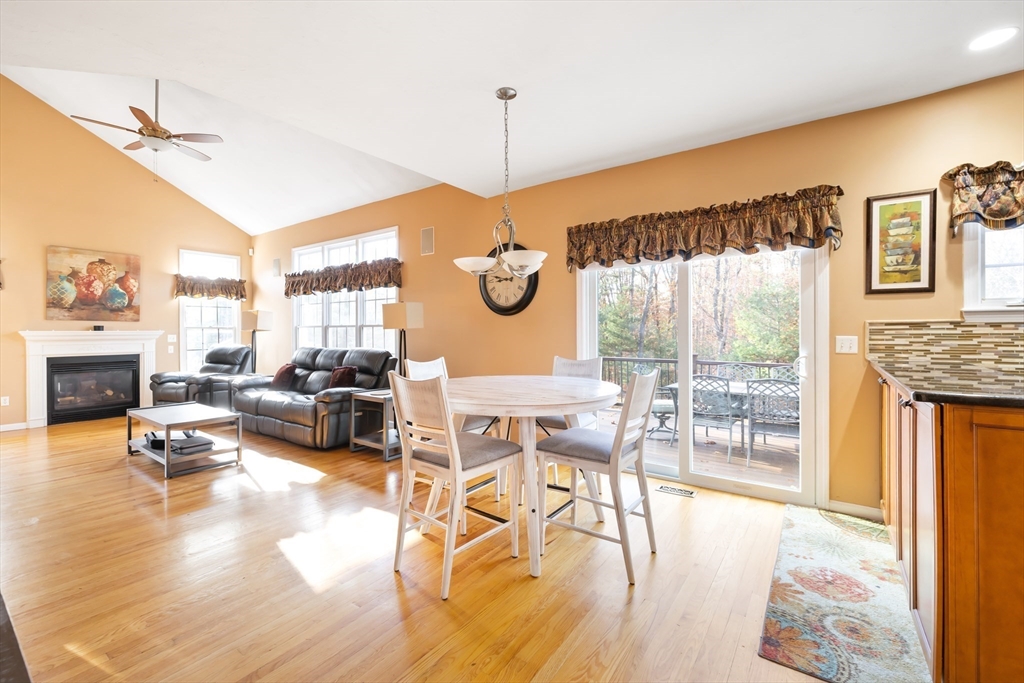 162 Ewald Avenue Marlborough, MA 01752 - Photo 10 of 30 a living room with furniture a fireplace and a floor to ceiling window