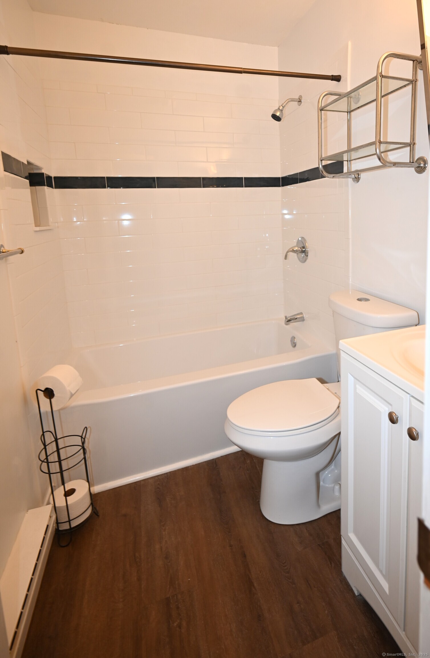 113 Union Street, Unit Z Deep River, CT 06417 - Photo 14 of 14 a white toilet sitting next to a bathroom sink