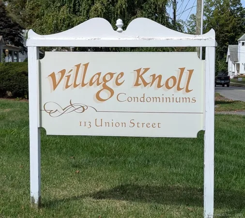 a sign that is on the side of the tree