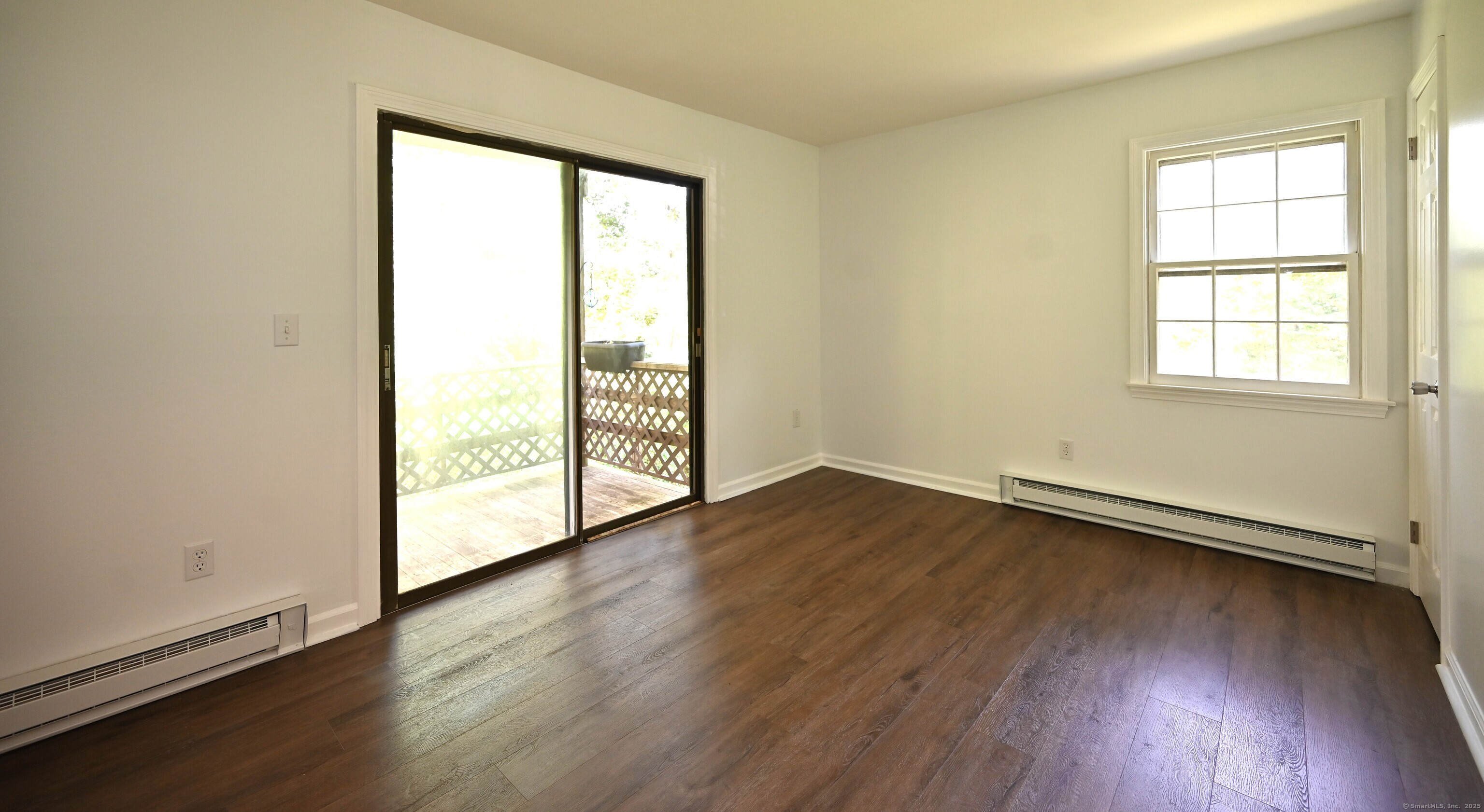 113 Union Street, Unit Z Deep River, CT 06417 - Photo 9 of 14 an empty room with wooden floor and windows