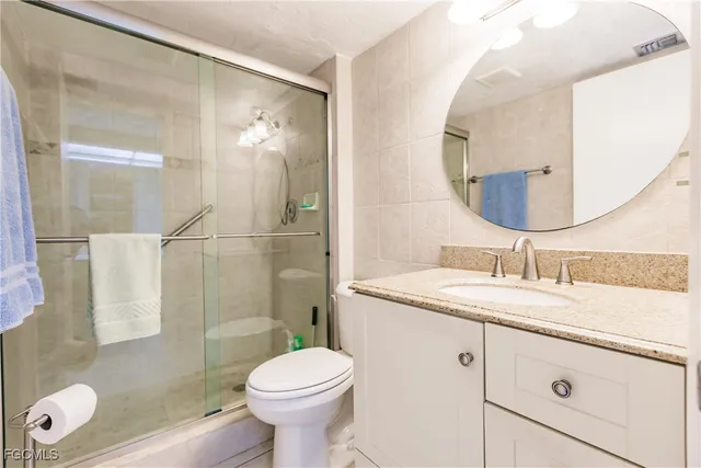 a spacious bathroom with a sink and a mirror
