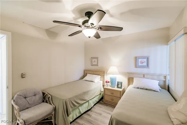 a living room with furniture and flowers