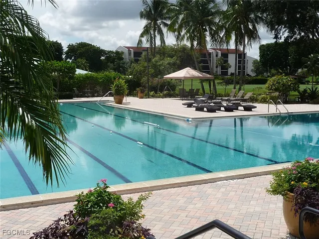 a view of a white house with a ocean view