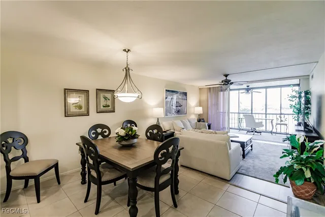 a view of a dining room with furniture and windows