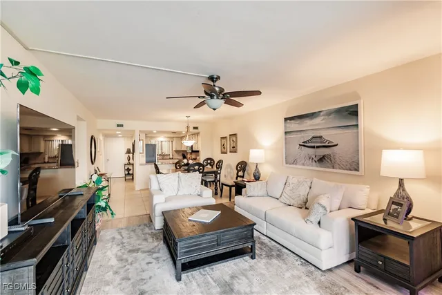 a view of a dining room and a table and chairs in the kitchen