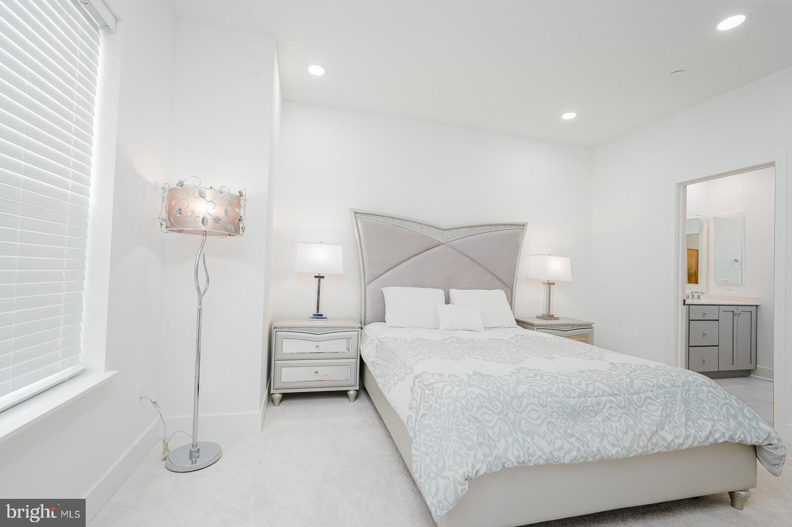 5345 Zenith Overlook Bethesda, MD 20816 - Photo 31 of 53 a bedroom with a bed and a lamp