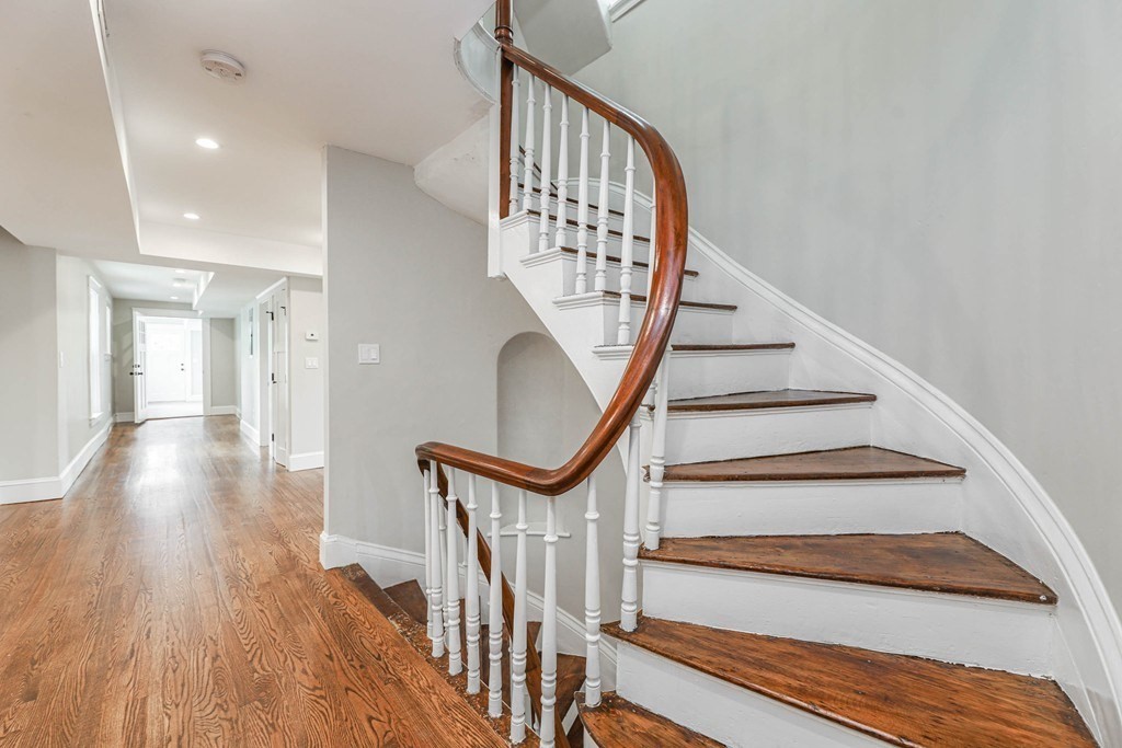 52 Maple Street, Unit 2 Boston, MA 02136 - Photo 15 of 41 a view of staircase with wooden floor and a rug