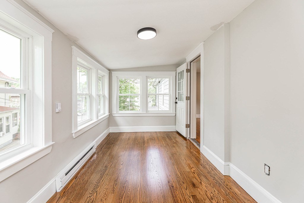 52 Maple Street, Unit 2 Boston, MA 02136 - Photo 24 of 41 a view of a room with wooden floor and a window