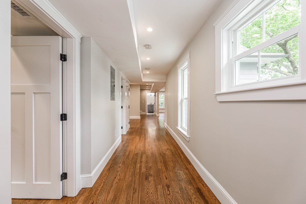 52 Maple Street, Unit 2 Boston, MA 02136 - Photo 27 of 41 a view of a hallway with wooden floor and staircase