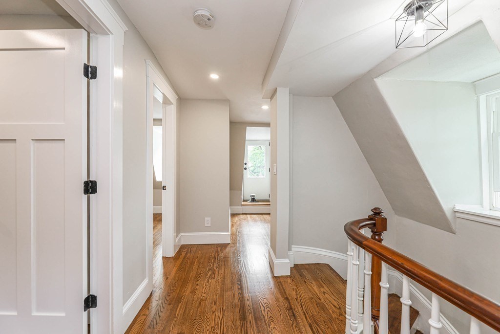 52 Maple Street, Unit 2 Boston, MA 02136 - Photo 31 of 41 a view of a hallway with wooden floor and staircase